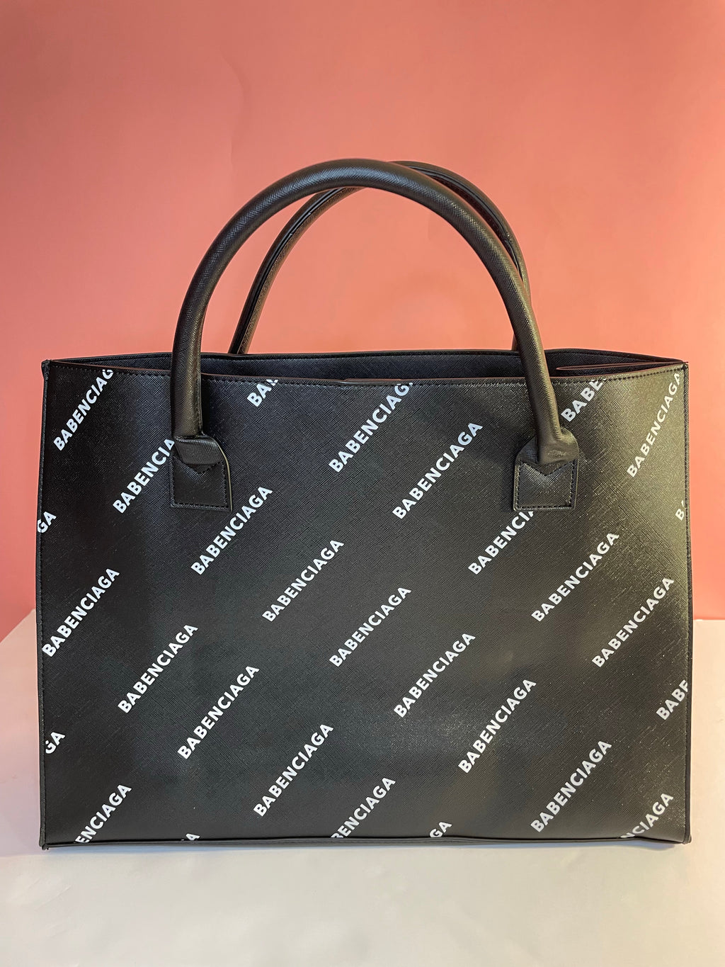J. ELISE BOUTIQUE luxurious 100% textured vegan leather black babenciaga all over  fashion tote. Metal clasp. Durable exterior. Easy product care.  A timeless silhouette.  
