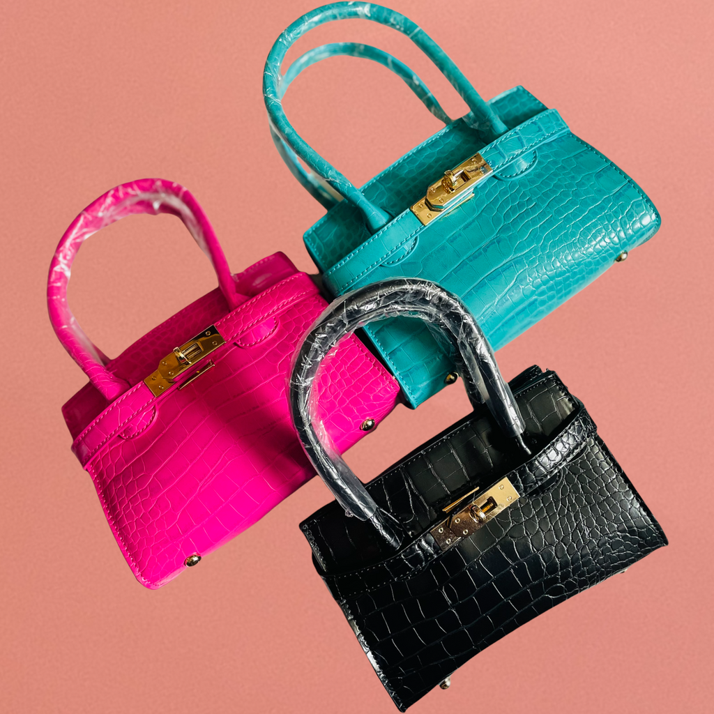 J. ELISE BOUTIQUE Croc Embossed Iconic Top Handle Bag Width - 7.5" Height - 5" Depth - 3" Composition - Polyurethane & Mix Metals Lead & Nickel Compliant  (Teal, Black & Fuchsia)