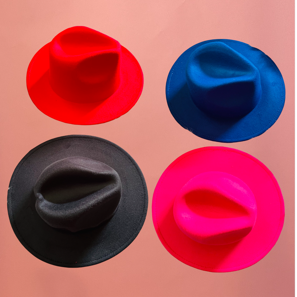 J. ELISE BOUTIQUE Stay on trend and turn heads in our wide brim accent red bottom fedora hats. Elevate any look from simple or basic to effortlessly stylish. Fedora Style Felt Hat with Bottom Accent Material: 65% cotton, 35% polyester Adjustable strap inside Hat Circumference: 56-58cm/22-22.8